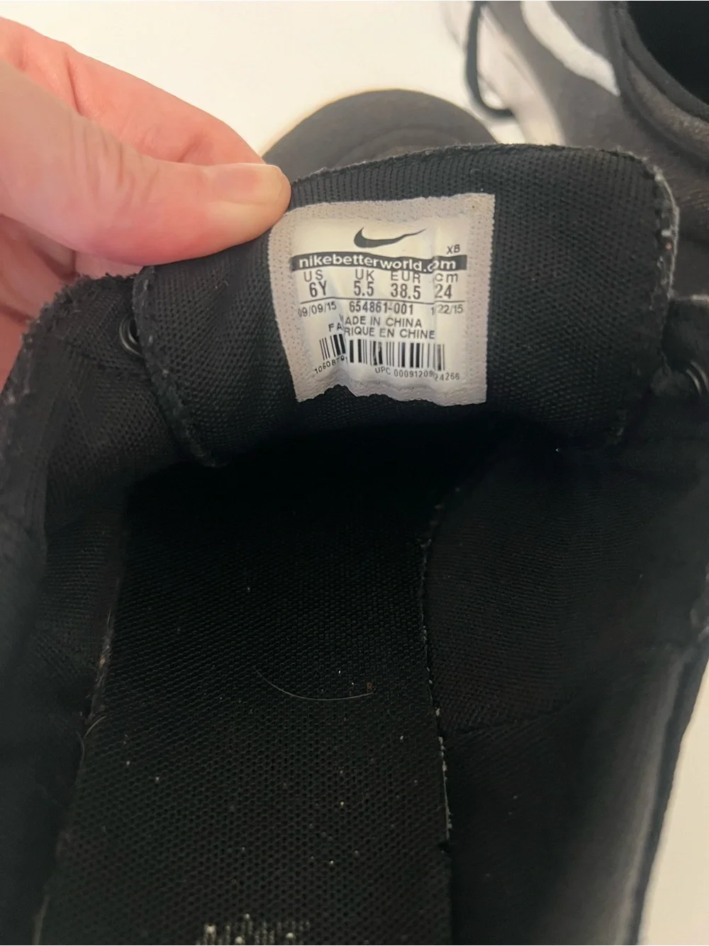 Nike Black Low-Top Sneakers with White Swoosh
